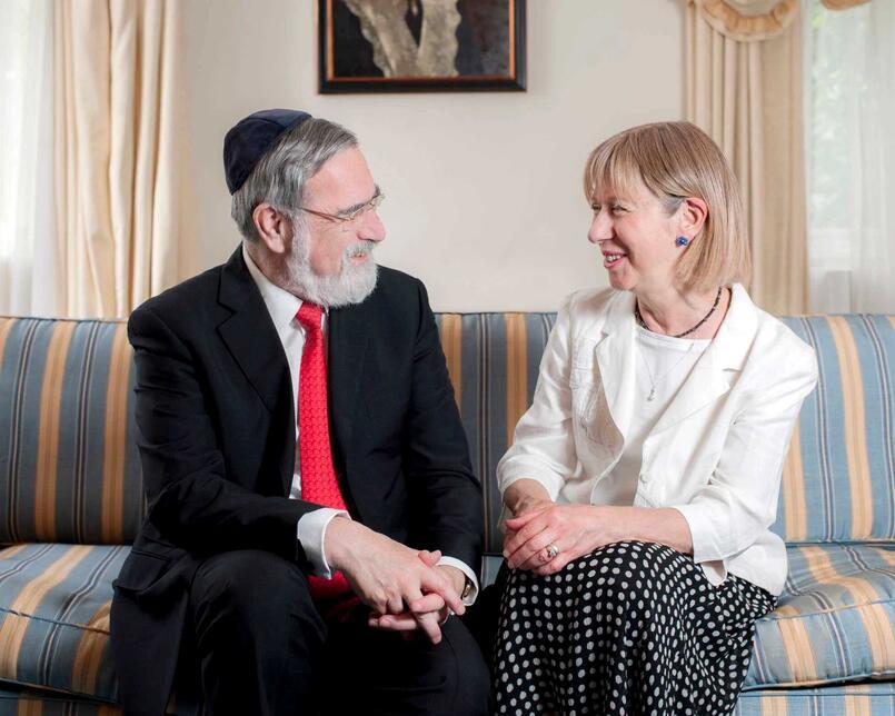 Rabbi Sacks and Lady Elaine Sacks on their sofa at home