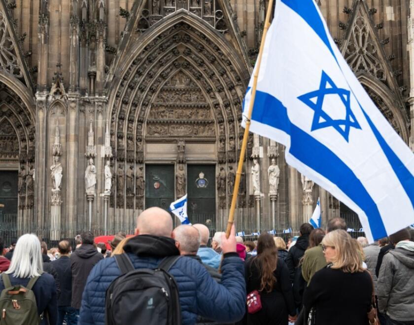Man holding Israeli flag in Germany