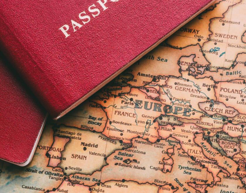 Passports over a map of Europe