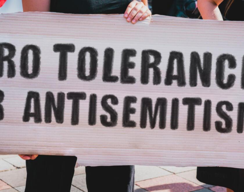 A protest sign against antisemitism
